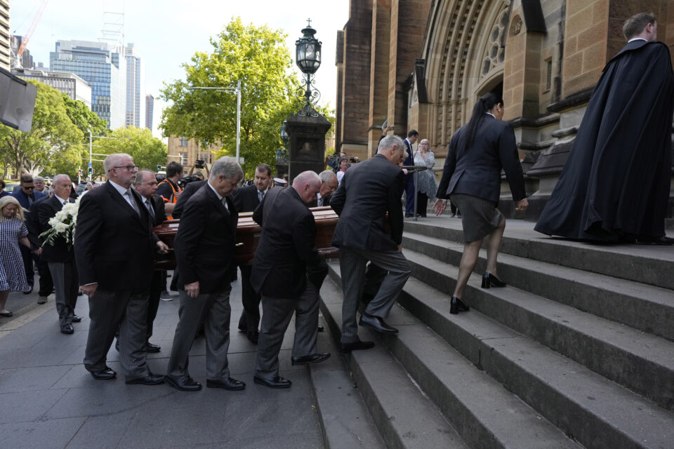 Moment protester arrested at Pell funeral