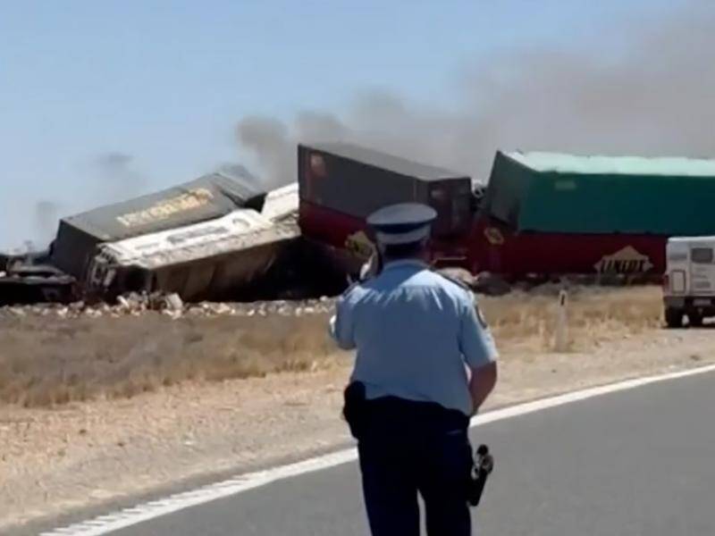 Charges after truck, train crash kills two
