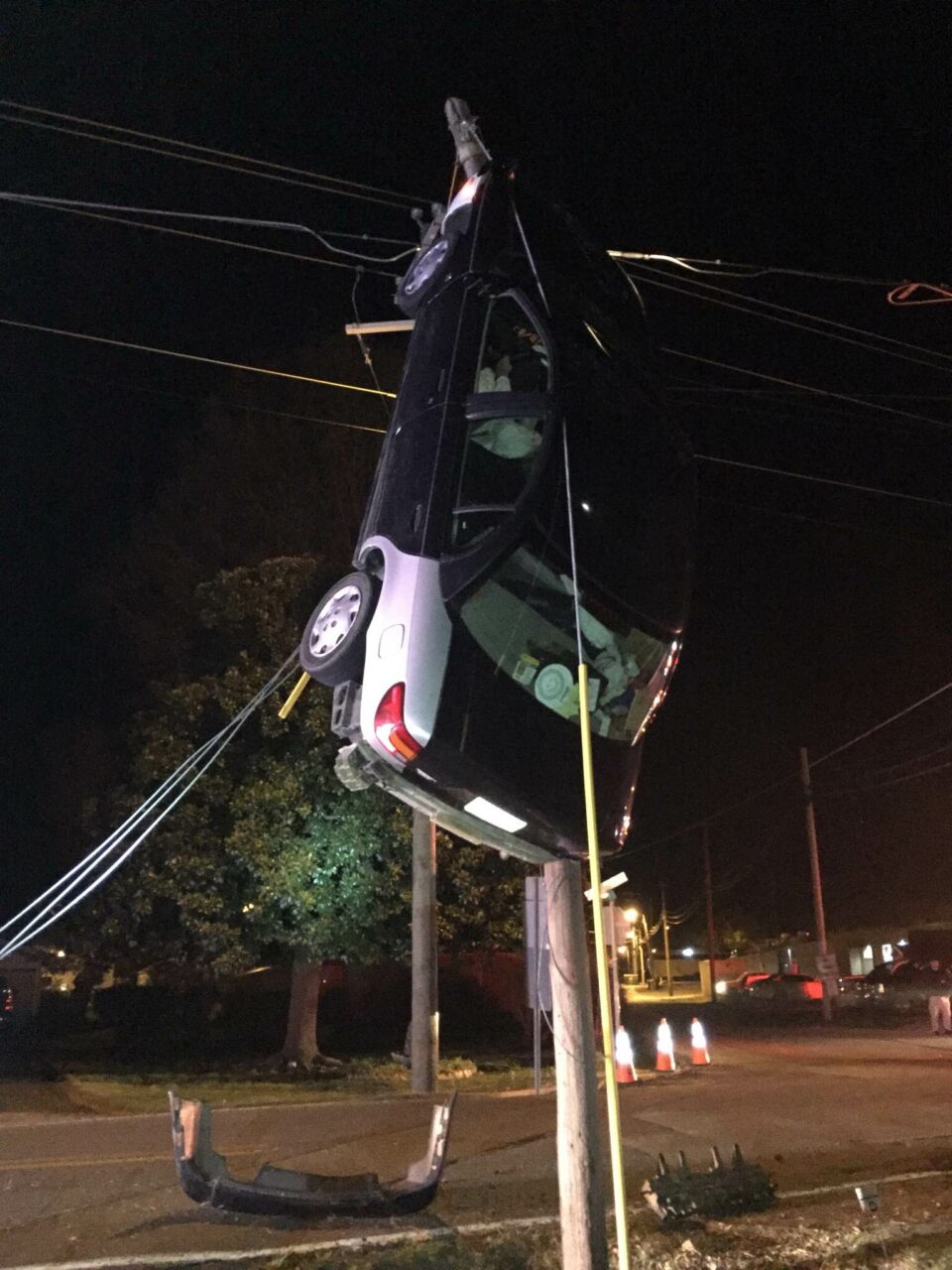 Woman trapped in van crashes into power pole